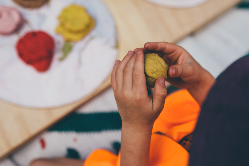 Child playing with Play Dough